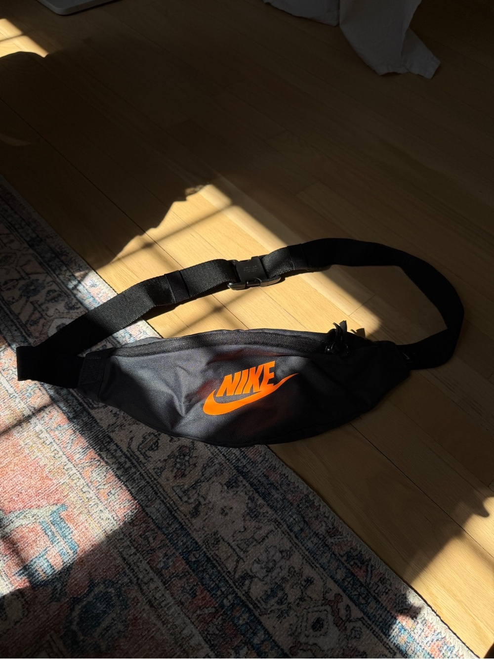 Nike Unisex Black Belt Bag with Orange Swoosh Logo